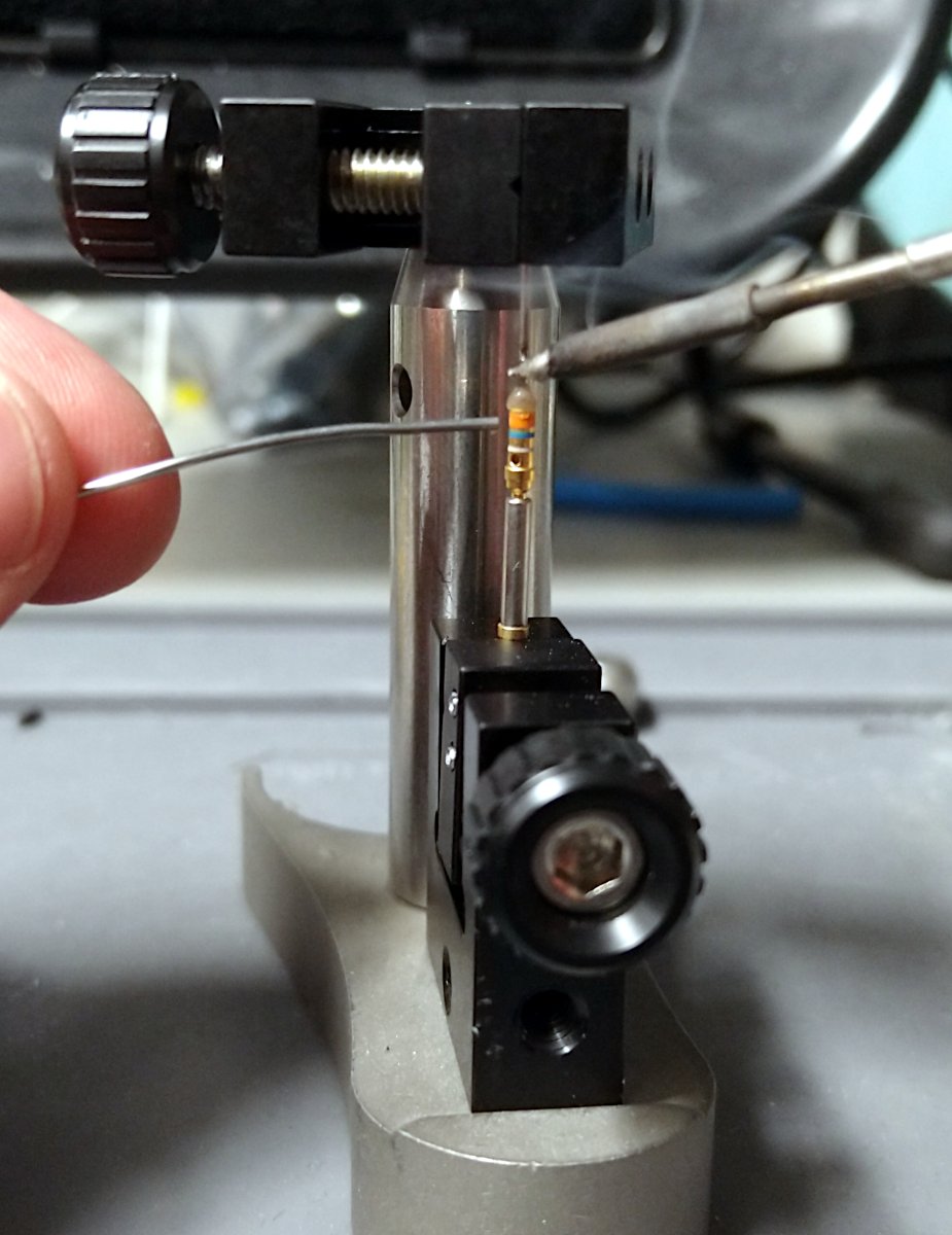 Soldering hypodermic tubing and the contact pin together
