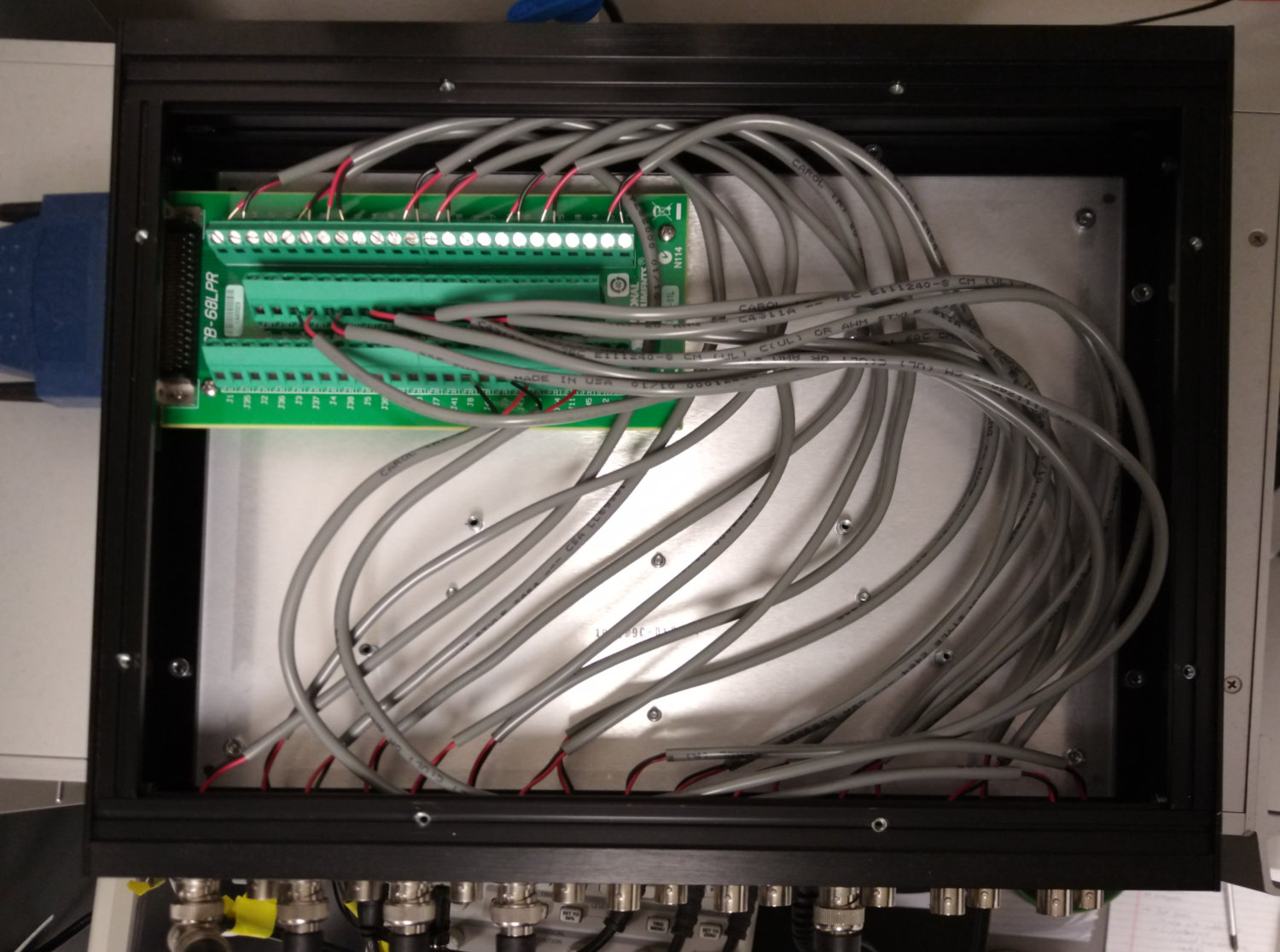 The inside of a CA-1000 enclosure with all 18 BNCs connected to an CB-68LPR